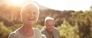 A senior woman and her husband enjoying assisted living memory care outdoors in Idaho