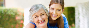resident and a nurse outside in the retirement home assisted living or memory care garden